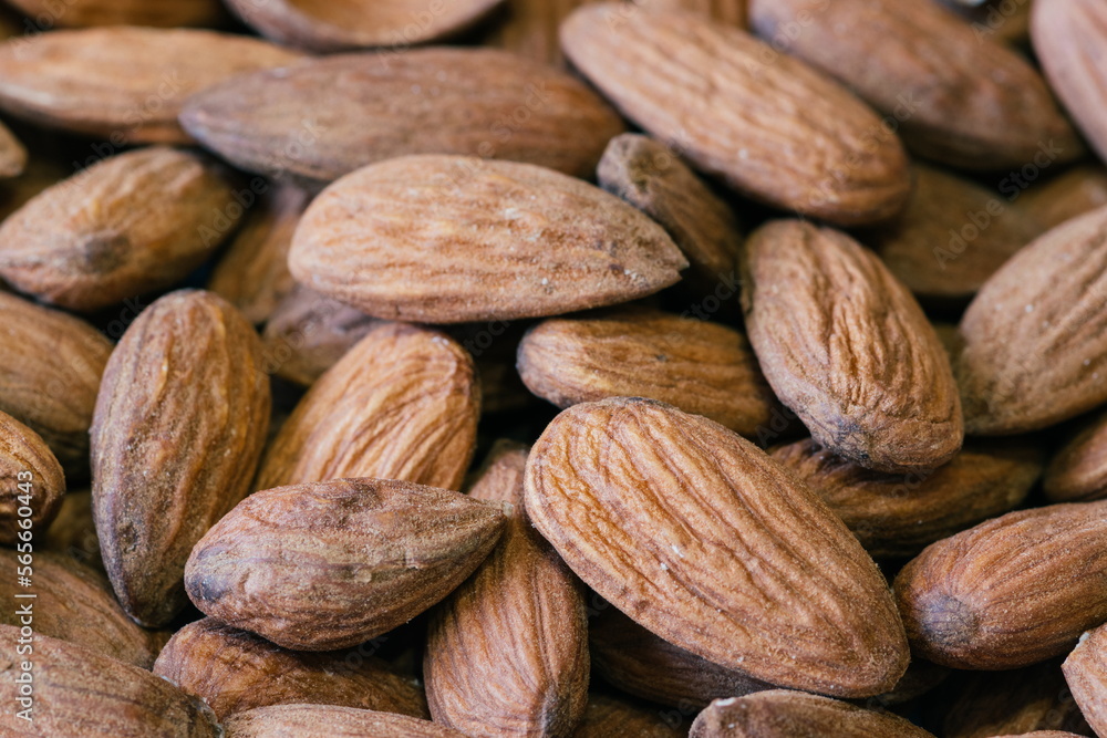 Almond nuts close. Background of almond nuts. Pile of almonds cl Almond nuts close. Background of almond nuts. Pile of almonds cl