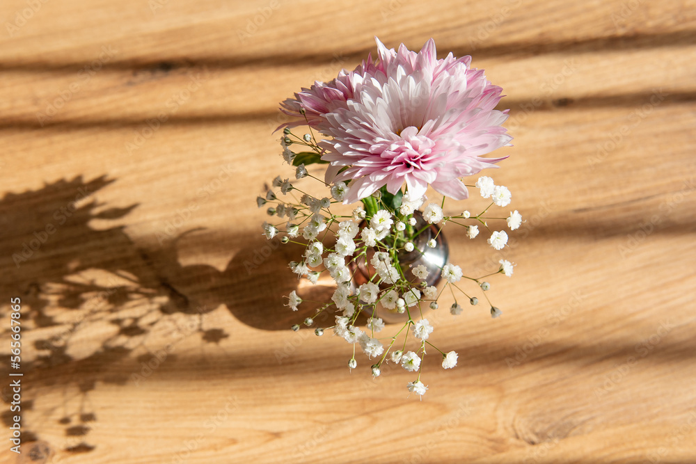 flowers on a wooden background with a blurred background in the foreground flowers on a wooden background with a blurred background in the foreground