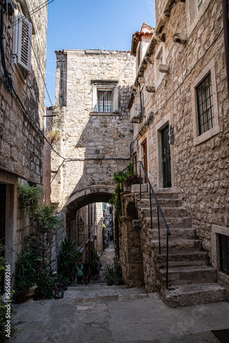 Fototapeta Naklejka Na Ścianę i Meble -  Morning on narrow street of Mediterranean town.