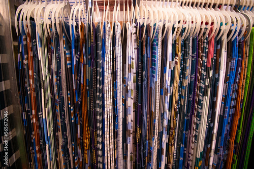 Traditional Bangladeshi men's wear lungi hanging on a rack in a store. texture background
