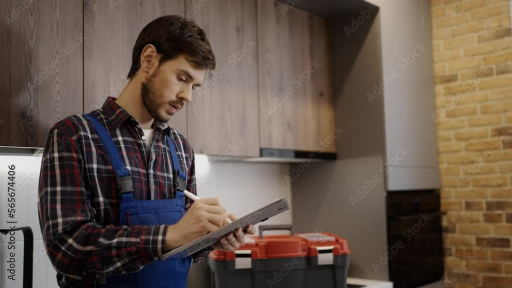 Repairman examining house for further work, writing down work cost estimate Repairman examining house for further work, writing down work cost estimate