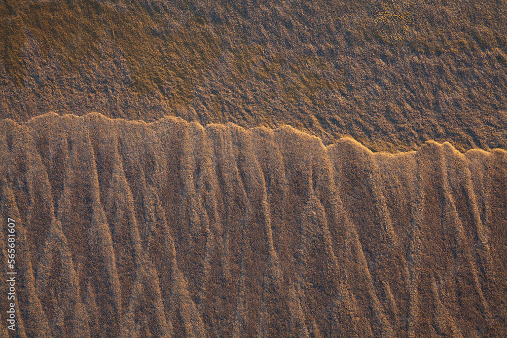 Fototapeta premium Closeup abstract of patterns and textures in sand 