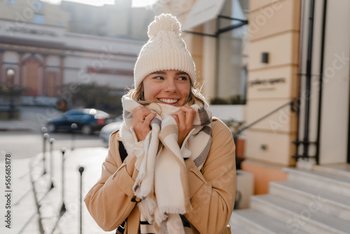 stylish woman walking in winter street