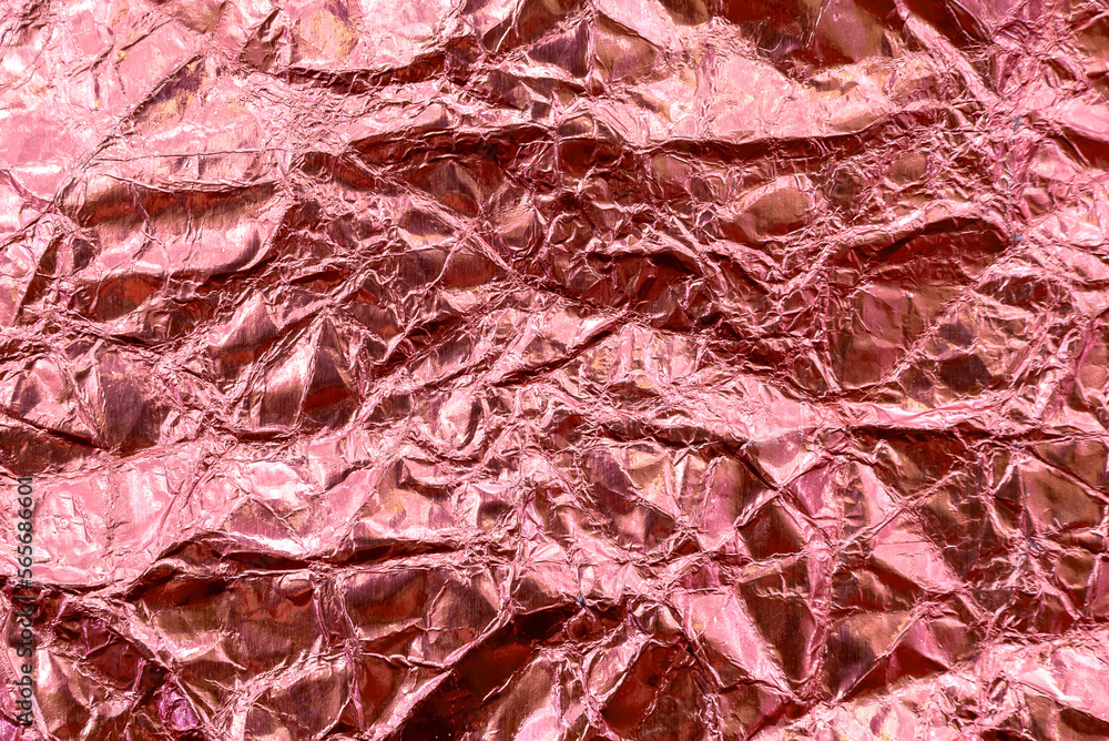 Texture of crumpled, crumpled foil in purple, pink, color. Foil banner website Texture of crumpled, crumpled foil in purple, pink, color. Foil banner website