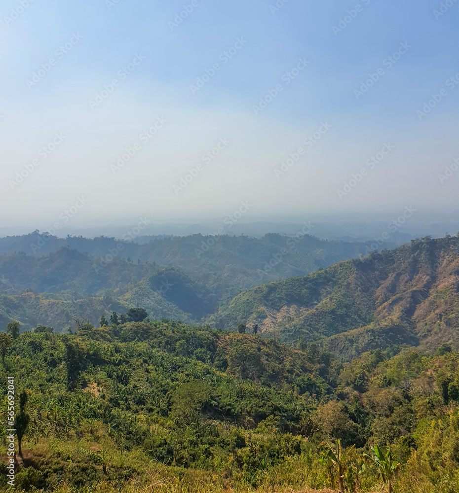 View of the hills of Bandarban, Bangladesh from top of a famous hill during the summer. Hills of bangladesh