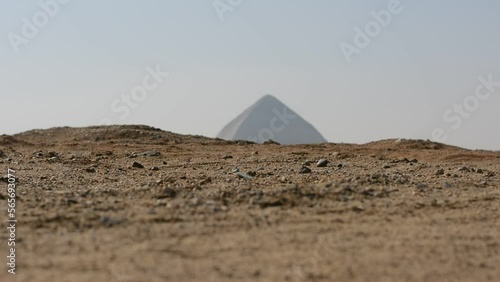 The Bent Pyramid of king Sneferu, A unique example of early pyramid development in Egypt located at Dahshur Badrashin Badrshein city, made of ancient limestone, height 104 meters, base 189 meters photo