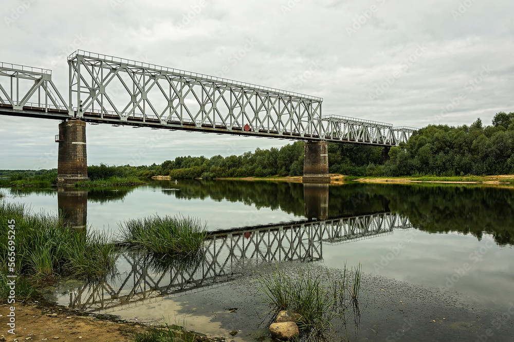 Fototapeta premium Several sections of the railway bridge are laid over the river bed