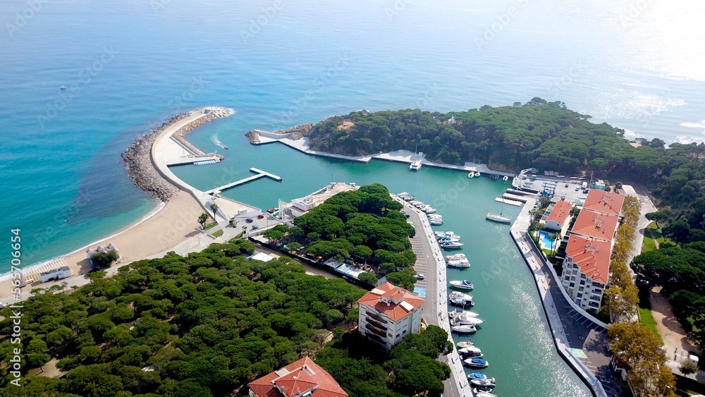 port entrance to marina with yachts and boats in Port d'Aro near Platja d'Aro, Catalonia, Spain