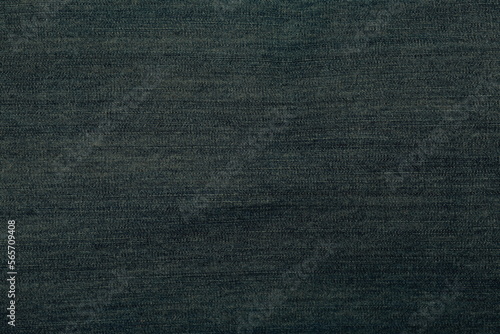Denim texture. Closeup. Dark blue-green color. Horizontal picture.