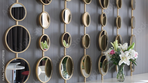 many round decorative mirrors hanging on the wall