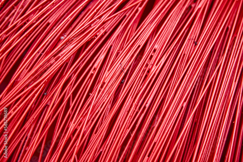 Bright red plastic wire as a background. Beautiful textured surface.