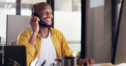 Call center, customer service and black man consultant in the office doing a consultation online. Contact us, ecommerce sales professional and male telemarketing agent working on a crm