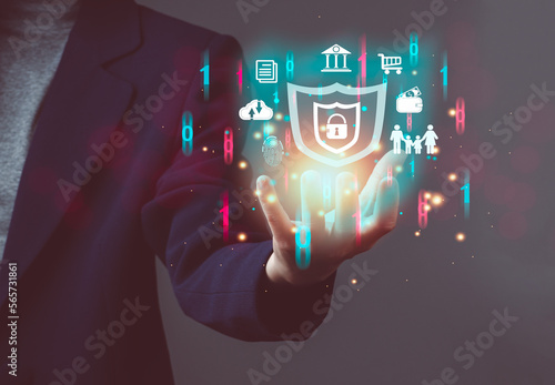 Cybersecurity and privacy concepts to protect data. shield icon and internet network security technology. Businessman protecting personal data on tablet with virtual screen interfaces. cyber security.