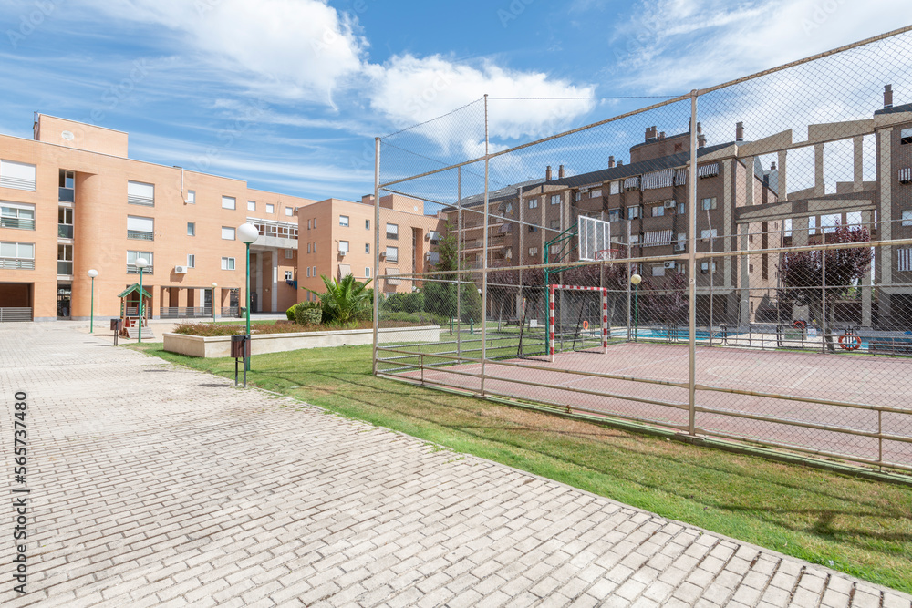 Common areas with a seven-a-side soccer field, gardens and children's play areas in a residential housing development