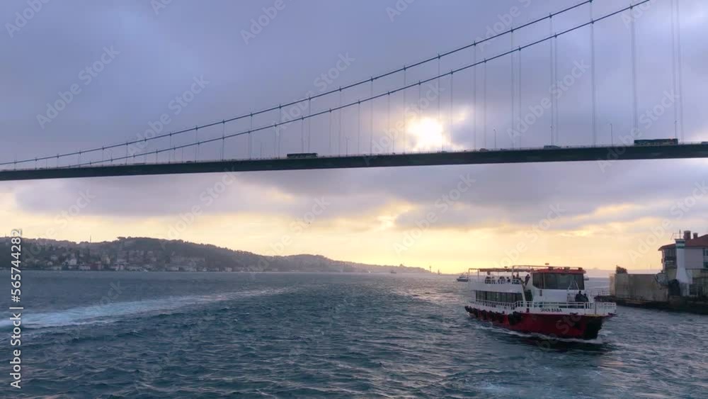 The ferry sails along the Bosphorus against the backdrop of the Bosphorus Bridge. Ferry in the Bosphorus The ferry sails along the Bosphorus against the backdrop of the Bosphorus Bridge. Ferry in the Bosphorus