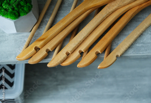wooden hangers on a gray table