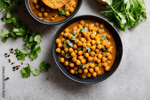 Chickpea dish with curry, cooked chickpeas with spices and herbs. Vegetarian food photo