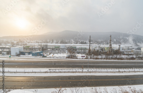 Mountain town highway road and oil plant during snow weather, travel USA town © Stock fresh 