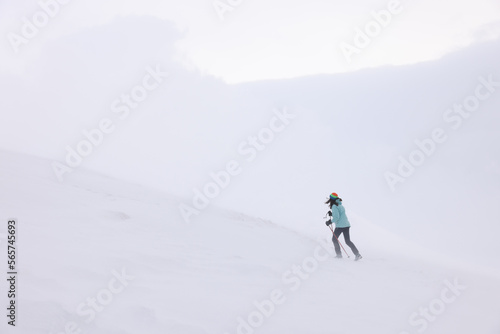 Winter mountain climbing in harsh blizzard conditions, Parng Mountains, Romania, Europe