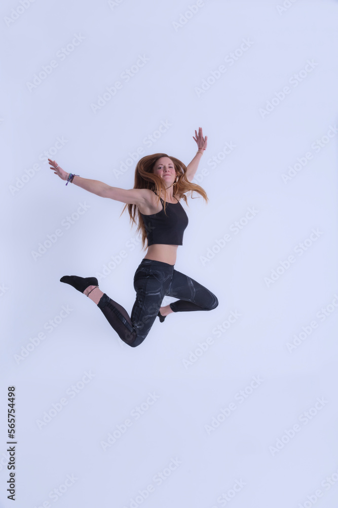 young woman with long hair jumping happy young woman with long hair jumping happy