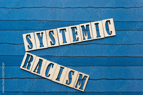 systemic racism sign on blue scrapbook paper with lines photo