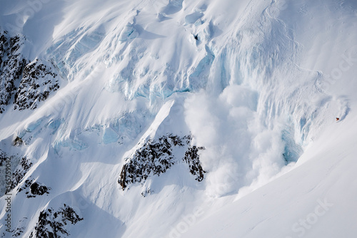A male skier skis around some nasty icefall in Haines, Alaska photo
