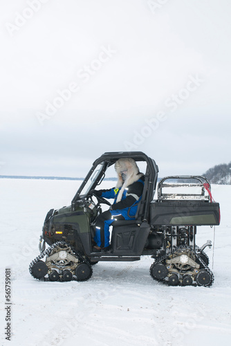 An angler drives his fishing utility vehicle at worldâ€™s largest ice fishing tournament in Minnesota. photo