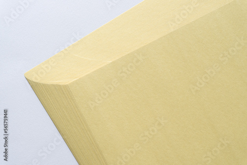 pile of pale yellow construction paper