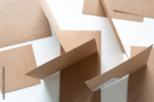 standing brown paper squares or geometric shapes on blank paper 