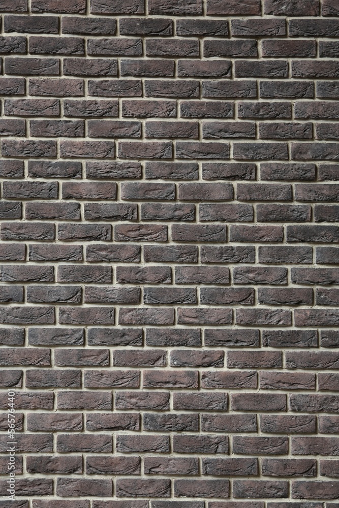 Fototapeta premium Texture of brown brick wall as background, closeup