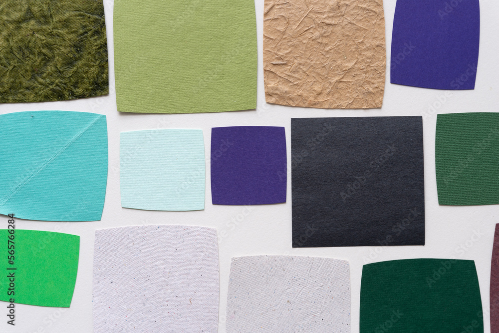 Fototapeta premium collection of roughly square paper shapes on a blank background