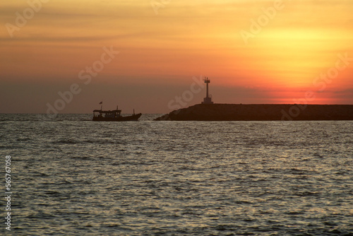 lighthouse with beautiful sunset and the ocean background © leisuretime70