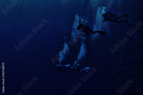 group of divers depth bubbles dive