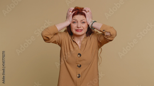 Obraz na plátně Young redhead woman feeling hopelessness loneliness, nervous breakdown, loses becoming surprised by lottery results, bad fortune, loss, unlucky news