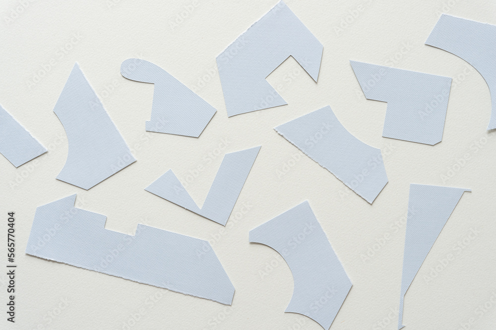 cut pastel blue paper shapes on blank paper cut pastel blue paper shapes on blank paper