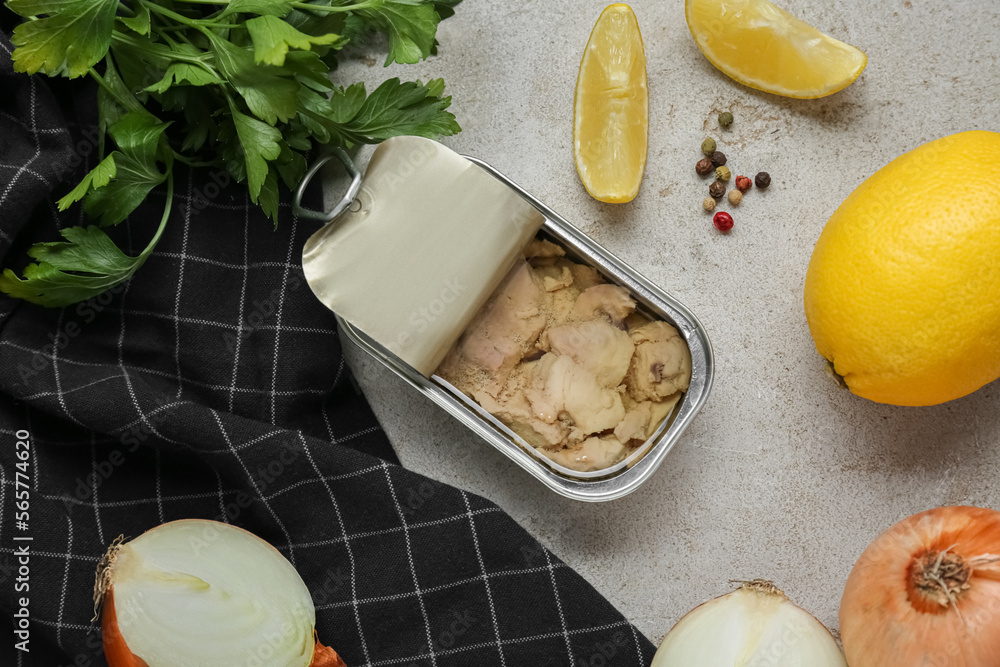 Flat lay composition with tin can of tasty cod liver and different products on textured table Flat lay composition with tin can of tasty cod liver and different products on textured table