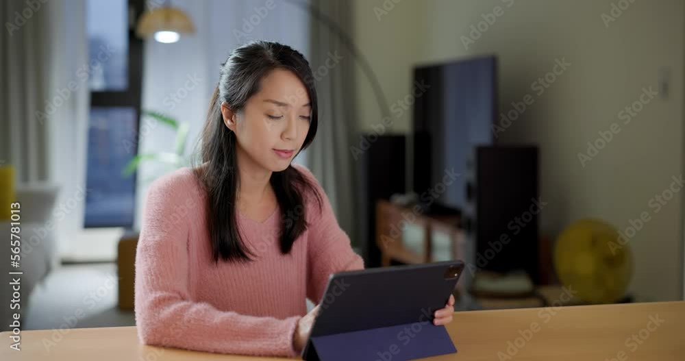 Woman work on tablet computer at home Woman work on tablet computer at home