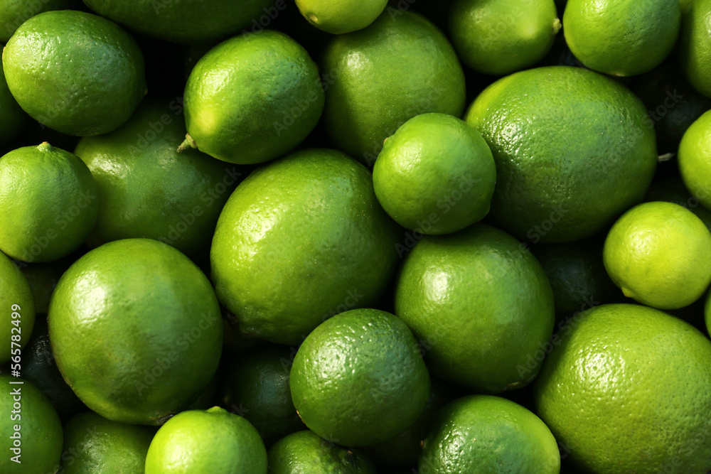 Fresh ripe green limes as background, top view Fresh ripe green limes as background, top view
