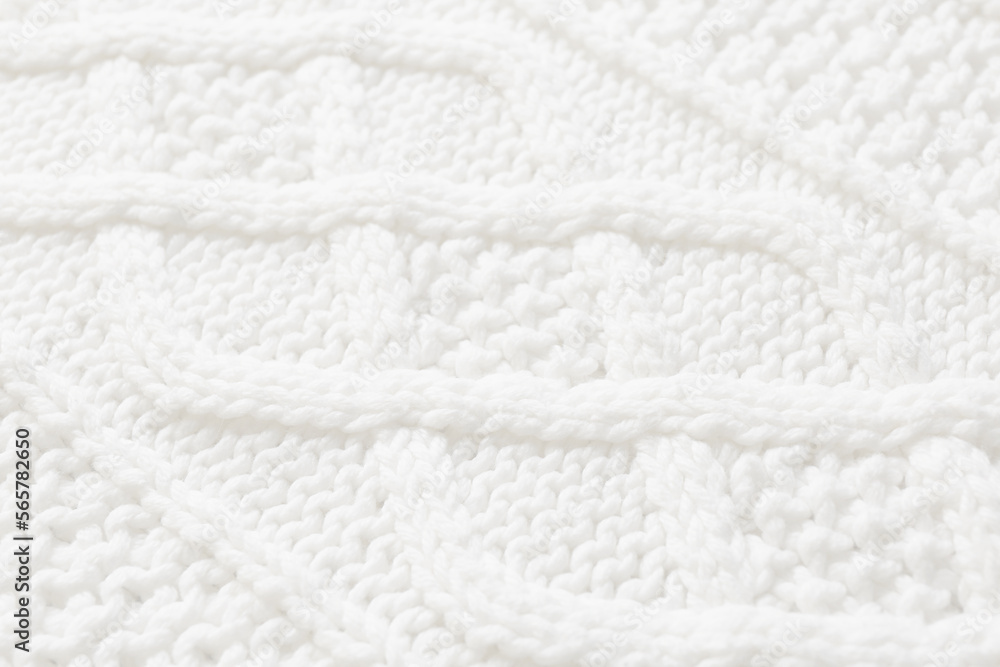White knitted fabric with beautiful pattern as background, closeup White knitted fabric with beautiful pattern as background, closeup