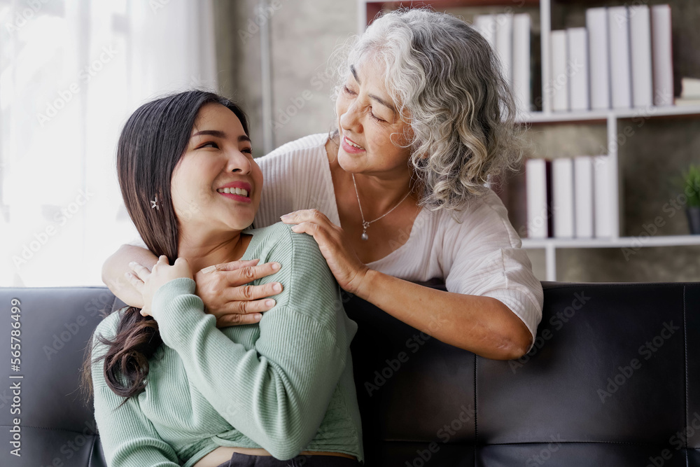 Candid attractive beautiful mum sit at cozy sofa couch living room in