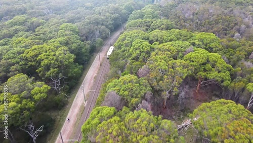 Aerial drone view of a tram traveling from the Sydney tram museum in Loftus toward the Royal National Park railway station in Audley, Southern Sydney, New South Wales, Australia   photo