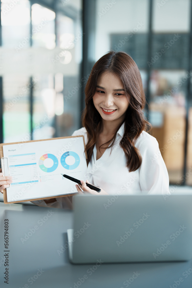Business work and planning, portrait of a businesswoman using a computer in a meeting Business work and planning, portrait of a businesswoman using a computer in a meeting