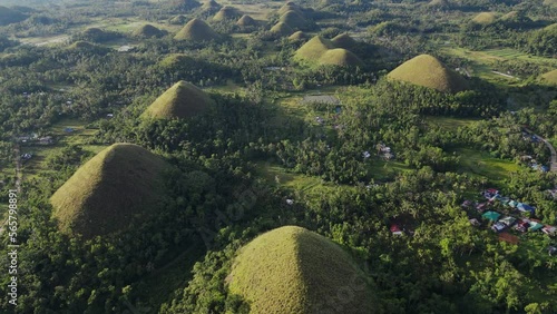 Beautiful drone view of chocolate hills at sunset. Bohol Province and numerous hills, which are on list of most important tourist destinations in Philippines. Geological monument on island of Bohol.