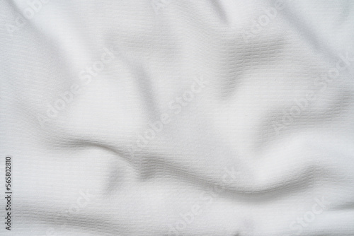 Closeup elegant crumpled of white silk fabric cloth background and texture. Luxury background design.