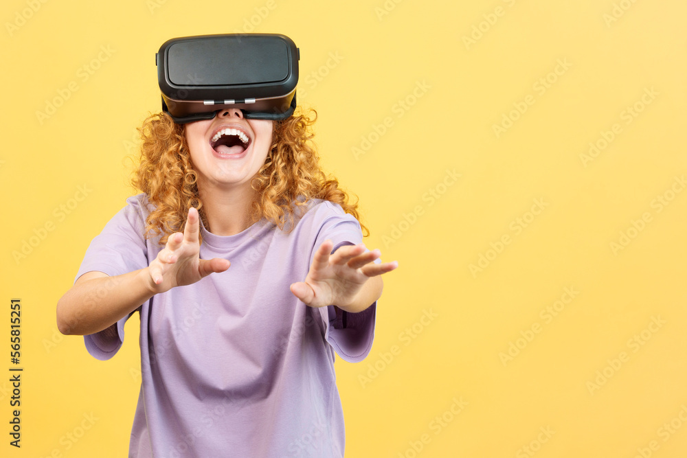 Surprised woman smiling while using virtual reality goggles Surprised woman smiling while using virtual reality goggles