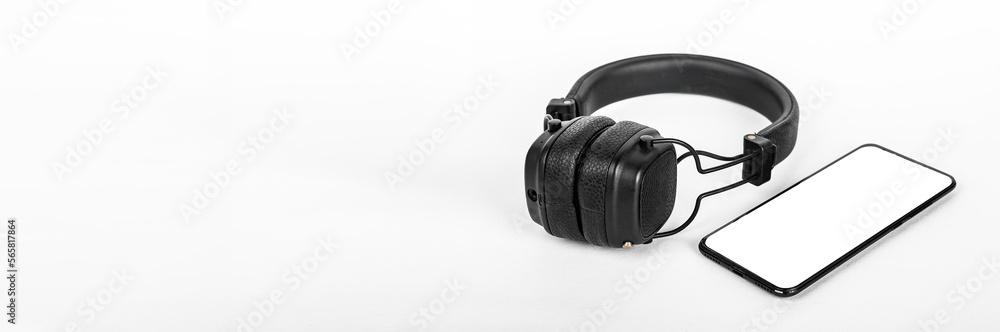 Mobile phone mockup, headphones on banner, ad background. Smar phone screen mock up, template for audio music podcast application promotion Mobile phone mockup, headphones on banner, ad background. Smar phone screen mock up, template for audio music podcast application promotion