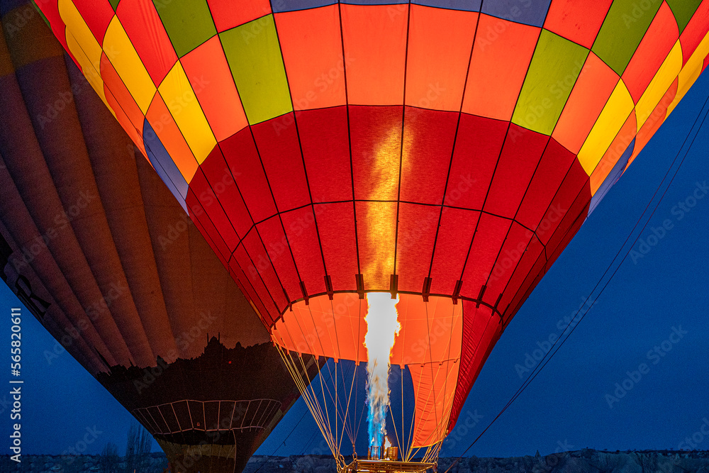 Fototapeta premium Morning start of a Hot air balloons (atmosphere ballons) flying over mountain landscape at Cappadocia, Turkey