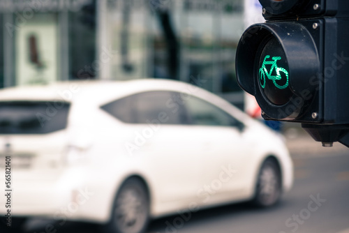 Green traffic light for bicycle against car on the street © Yury Kirillov