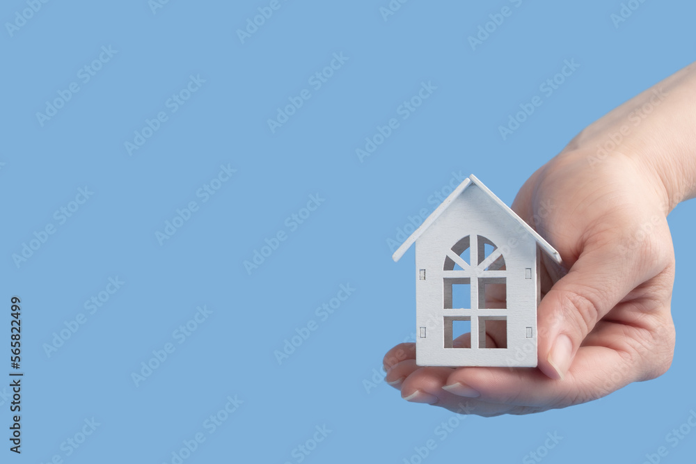 sale and rental of real estate, property insurance, credit, mortgage, hands holding a house sale and rental of real estate, property insurance, credit, mortgage, hands holding a house