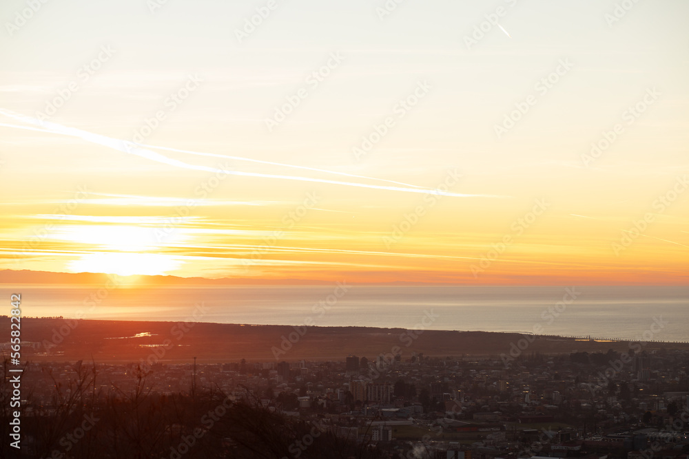 city sunset, evening sunrise, sea view, aerial cityscape in sunlight